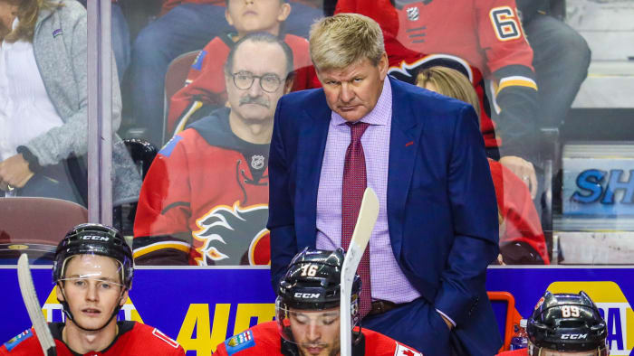 Flames coach Bill Peters on the bench